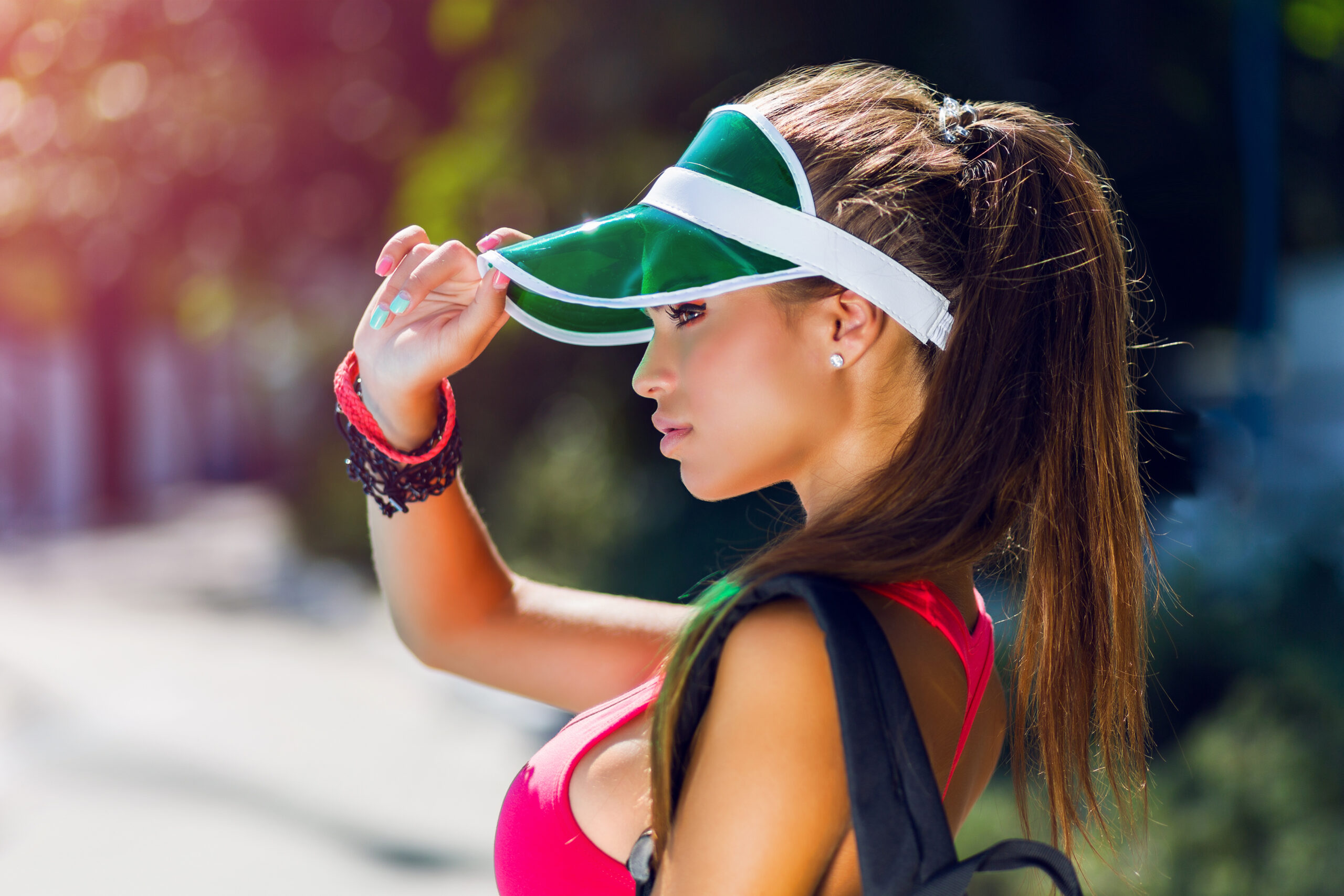 close-up-lifestyle-portrait-fitness-pretty-young-woman-stylish-cap-wearing-pink-sports-bra